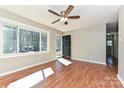 Bright living room with hardwood floors, a ceiling fan, and a view of the front door at 1961 Franklin St, Rock Hill, SC 29732