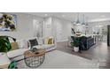 Open-concept living room featuring a modern sofa, stylish coffee table, and seamless flow to the kitchen at 201 Bennett Trail Dr, Mount Holly, NC 28120