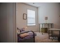 Cozy bedroom featuring a window for natural light, perfect for relaxation at 2941 Glen Summit Dr, Charlotte, NC 28270