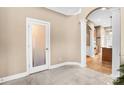 Welcoming foyer featuring marble floors, arched doorway, and decorative columns at 305 Chancelot Ln, Fort Mill, SC 29708