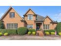 Elegant brick home with well-maintained landscaping and a welcoming front entrance at 3759 Sand Wedge Dr, Gastonia, NC 28056