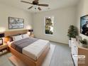 Cozy bedroom boasts natural light from the window, a comfortable bed, and stylish decor at 4922 Windchase Ln, Charlotte, NC 28269
