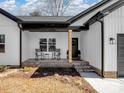 Inviting front porch with two rocking chairs perfect for enjoying the outdoors at 619 Berkshire Dr, Statesville, NC 28677