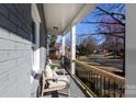 Inviting covered porch with comfortable seating, offering a relaxing outdoor space at 6813 Elm Forest Dr, Charlotte, NC 28212