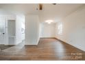 Spacious living room with hardwood flooring, white walls, and access to the kitchen area at 735 Green St, Rock Hill, SC 29730