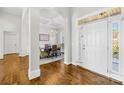 Bright foyer with hardwood flooring and arched entry to the dining room at 7362 Vanguard Ct, Stanley, NC 28164