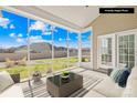 Cozy screened porch with comfortable seating, perfect for relaxation at 7362 Vanguard Ct, Stanley, NC 28164