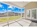 Inviting screened porch offering views of the backyard at 7362 Vanguard Ct, Stanley, NC 28164