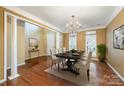 Elegant dining room with hardwood floors, chandelier, and lots of natural light at 10349 Linksland Dr, Huntersville, NC 28078