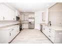 Bright kitchen features stainless appliances, granite counters, and white cabinets at 171 Meadowlark Ln, Statesville, NC 28625