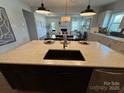 Open-concept kitchen with large island, breakfast bar, and stainless steel appliances at 228 Heatherland Dr, Rock Hill, SC 29732