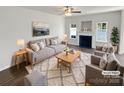 Bright living room featuring a cozy fireplace, plush seating, and stylish decor, ideal for relaxation at 246 Tail Race Ln, Fort Mill, SC 29715