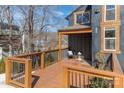 Inviting deck area with wood railings and lake views, perfect for outdoor relaxation and entertainment at 27068 Catamaran Dr, Tega Cay, SC 29708