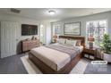 Stylishly staged main bedroom features a comfortable bed, modern decor, and ample natural light at 4070 Shasta Cir, Clover, SC 29710