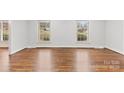 Inviting living room with hardwood floors and natural light from two large windows at 410 Deerwood Dr, Gastonia, NC 28054