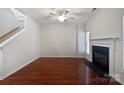 Living room with hardwood floors and fireplace; ready for personalized design at 5084 Parkview Way, Matthews, NC 28104