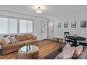 Bright living room with hardwood floors, neutral paint, and comfortable seating, creating a cozy atmosphere at 5240 Nc Hwy 73 Hwy, Iron Station, NC 28080