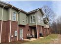 Exterior view of home shows siding and brick, with multiple windows at 773 Iris Ln, Newton, NC 28658