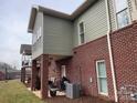 Exterior view shows brick and siding and outdoor patio at 773 Iris Ln, Newton, NC 28658