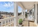 Inviting front porch with ample space for seating and enjoying the neighborhood views at 805 Deep River Way, Waxhaw, NC 28173