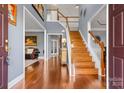Grand foyer with hardwood floors, high ceilings, and staircase at 9623 Laurie Nw Ave, Concord, NC 28027