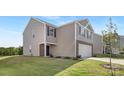An eye-level view of a charming, two-story home highlighting its siding, stone accents, and well-manicured lawn at 1011 20Th Avenue Se Loop, Hickory, NC 28602