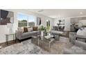 Bright living room with neutral decor, stylish furniture, and large windows showcasing a welcoming space at 1011 20Th Avenue Se Loop, Hickory, NC 28602