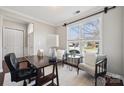 Bright office features a desk, chairs, and a large window with natural light at 1121 Mckee Farm Ln, Belmont, NC 28012