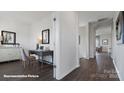 Long hallway with wood flooring and a view of the office and living room at 121 Meadow View Dr, Statesville, NC 28677