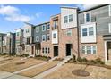 Attractive townhome with well-maintained landscaping, offering curb appeal and modern design at 1645 Unison Dr, Charlotte, NC 28262