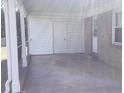 View of the covered carport featuring a concrete floor, storage area and direct access to the house at 2883 Westfield Nw Ave, Concord, NC 28027