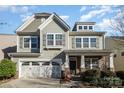 Charming two-story home featuring a craftsman-style facade, stone accents, and a two-car garage at 3004 Fallondale Rd, Waxhaw, NC 28173