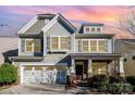 Charming two-story home featuring a craftsman-style facade, stone accents, and a two-car garage at 3004 Fallondale Rd, Waxhaw, NC 28173