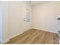 Inviting foyer with wood-look floors and a glass-paneled door for ample natural light at 3904 Craig Ave, Charlotte, NC 28211