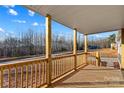 View from the covered front porch showcasing wooden railings and natural light at 451 Lookout Dam Rd, Statesville, NC 28625