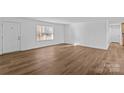 Bright living room with new hard surface floors, neutral walls, and a welcoming atmosphere at 451 Lookout Dam Rd, Statesville, NC 28625