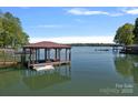 Private boat dock featuring covered moorage and sunny sky at 4786 Heather Ln, Denver, NC 28037
