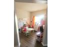 Bright playroom with cheerful decor and play station, ideal for ' creative activities at 6237 Shelley Ave, Charlotte, NC 28269