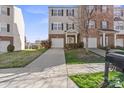 Charming townhome with attached garage, landscaped yard, and inviting entrance at 9724 Walkers Glen Nw Dr, Concord, NC 28027