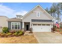 Charming single-Gathering home featuring a well-manicured front yard and two car garage at 1029 Dali Blvd, Mount Holly, NC 28120