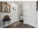 Bright foyer features hardwood floors, decorative art, and a convenient mirrored console table at 1196 Hummingbird Ln, Rock Hill, SC 29732