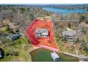 Aerial view showing the property line and brick home with a private dock and lush landscaping at 4164 54Th Ne Ave, Hickory, NC 28601