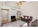 Cozy living room featuring a lofted space, neutral walls, decorative rug, and plush seating at 4400 Sharon Chase Dr, Charlotte, NC 28215