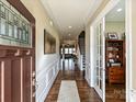 Elegant foyer showcases hardwood floors, decorative molding, and an open view to living spaces at 10000 Dressage Ln, Midland, NC 28107