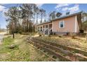 Charming home with lovely front yard, showcasing the exterior and landscaping at 1111 Barrington St, Wadesboro, NC 28170