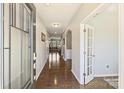 Inviting foyer with hardwood floors and neutral paint, leading to living areas at 11206 Grenfell Ave, Huntersville, NC 28078