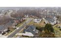 Overhead shot of a residential neighborhood with well-maintained homes, mature trees, and landscaped yards at 13132 Purple Dawn Dr, Charlotte, NC 28213