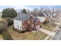 Well-maintained two-story home with brick and vinyl siding, mature trees, and a lush green lawn at 13132 Purple Dawn Dr, Charlotte, NC 28213