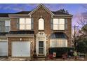 Charming brick home with a two-car garage, manicured landscaping, and a welcoming front porch at 157 Talbert Town Loop, Mooresville, NC 28117