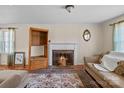 A living room featuring a fireplace, hardwood floors, an area rug and plenty of natural light at 1874 Mcilwain Rd, Lancaster, SC 29720